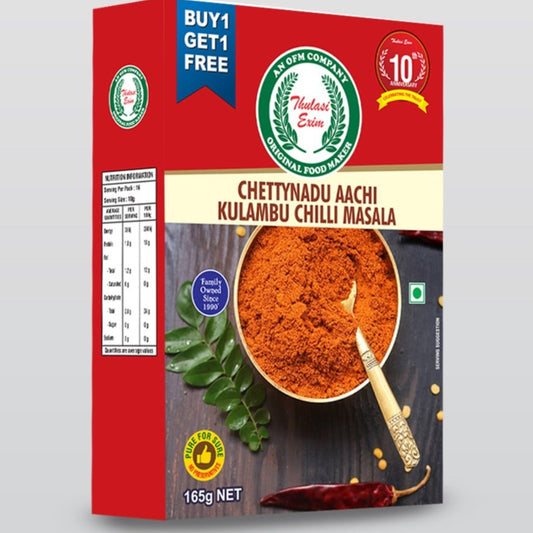 Chettinadu_Aachi_Kulambu_Masala_in_traditional_pouch_with_whole_spices_curry_leaves_and_kuzhambu_served_in_clay_pot_on_banana_leaf