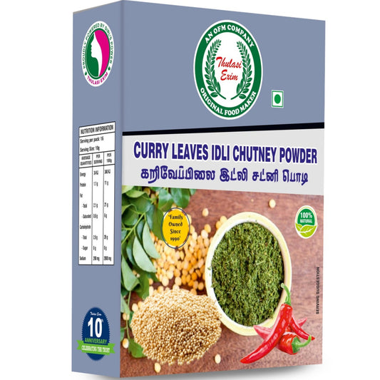 Curry Leaves idli Chutney Powder pouch with fresh curry leaves, roasted lentils, and a bowl of coarse herbal powder placed on a banana leaf background”