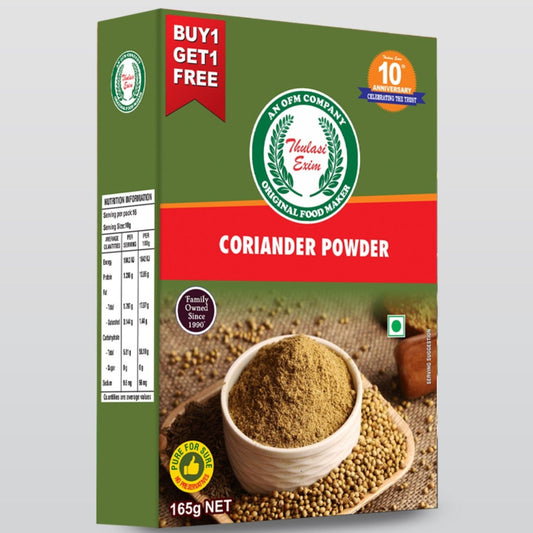 Thulasi_Coriander_Powder_in_kraft_pouch_with_fresh_basil_leaves_coriander_seeds_and_brass_spoon_on_a_traditional_South_Indian_cloth