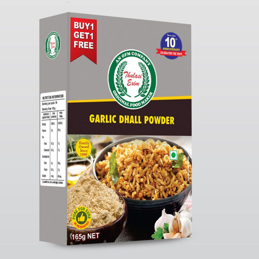 Thulasi_Garlic_Dal_Powder_in_eco-friendly_pouch_with_garlic_pods_and_basil_leaves_beside_a_bowl_of_rice